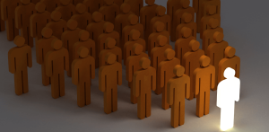 Humility In Leadership - arrow made up of yellow people icons with a glowing person at the front