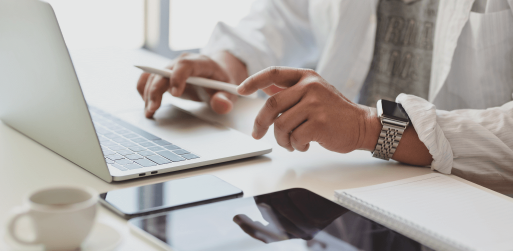 Project Manager - a person's hands typing on a computer