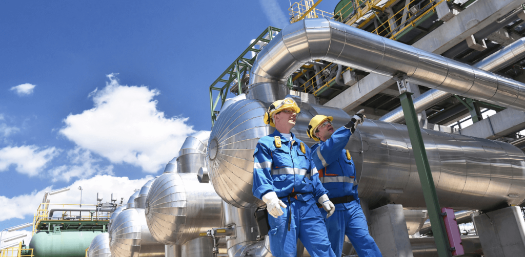 Project Manager - two men in PPE walking around a manufacturing site